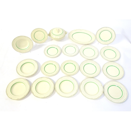 221 - A quantity of Clarice Cliff Art Deco dinner wares with green and gilt banded detail to include turee... 