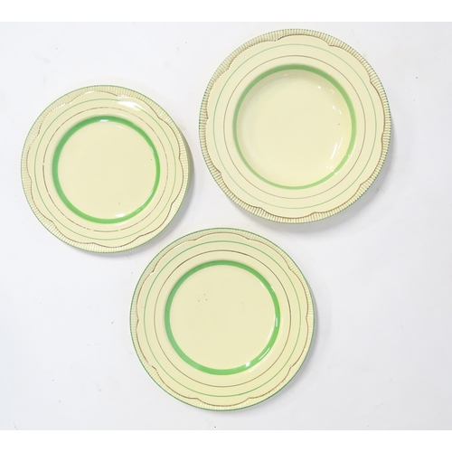 221 - A quantity of Clarice Cliff Art Deco dinner wares with green and gilt banded detail to include turee... 