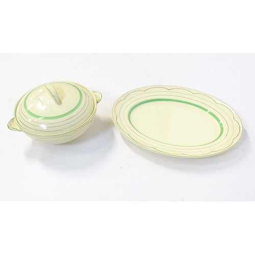 221 - A quantity of Clarice Cliff Art Deco dinner wares with green and gilt banded detail to include turee... 