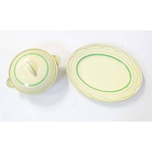 221 - A quantity of Clarice Cliff Art Deco dinner wares with green and gilt banded detail to include turee... 