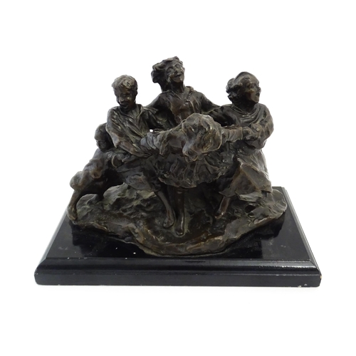 1028 - An early 20thC bronze figural group modelled as children playing. Raised on a rectangular wooden bas... 