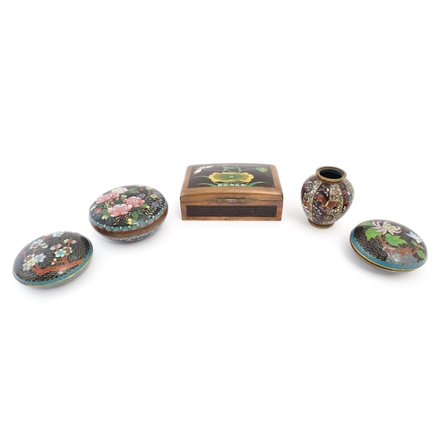 1059 - Five assorted items of Oriental black ground cloisonne comprising a box of rectangular form with flo... 