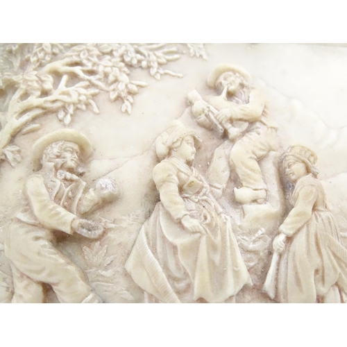 1159 - A Victorian wax plaque with relief and bas relief decoration depicting figures dancing in a landscap... 