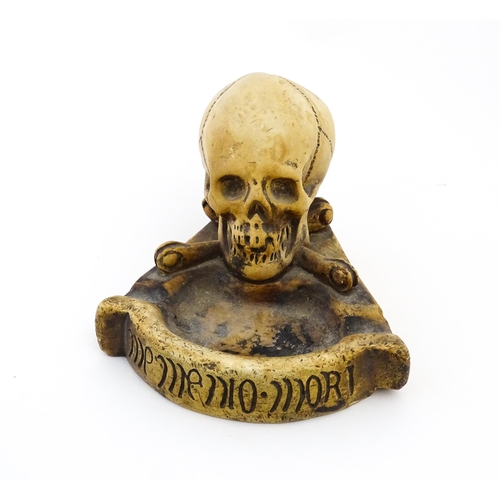 1174 - A 20thC composite Memento Mori ashtray with skull and crossed bone detail. Approx. 4