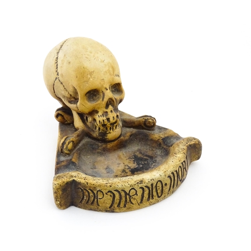 1174 - A 20thC composite Memento Mori ashtray with skull and crossed bone detail. Approx. 4