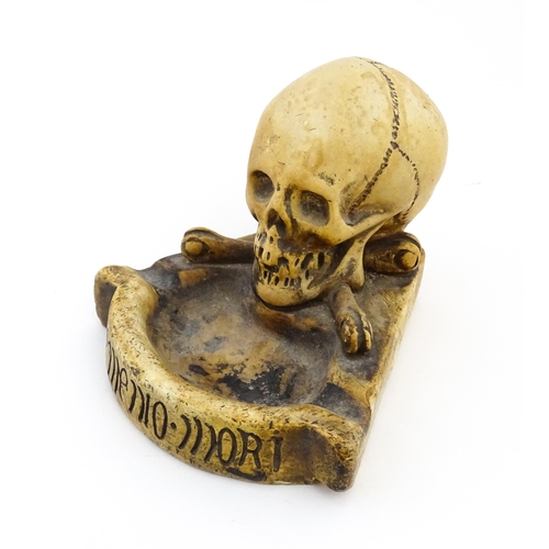 1174 - A 20thC composite Memento Mori ashtray with skull and crossed bone detail. Approx. 4