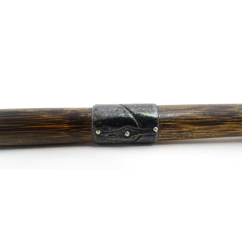 1297A - A late 19th / early 20thC palmwood walking stick / cane with white metal mounts. Together with a ano... 