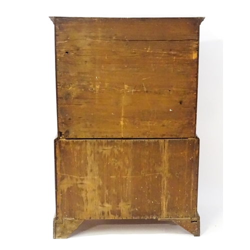 1448 - A late 19thC oak chest on chest, with a moulded cornice above two short over five graduated drawers ... 