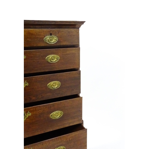 1448 - A late 19thC oak chest on chest, with a moulded cornice above two short over five graduated drawers ... 