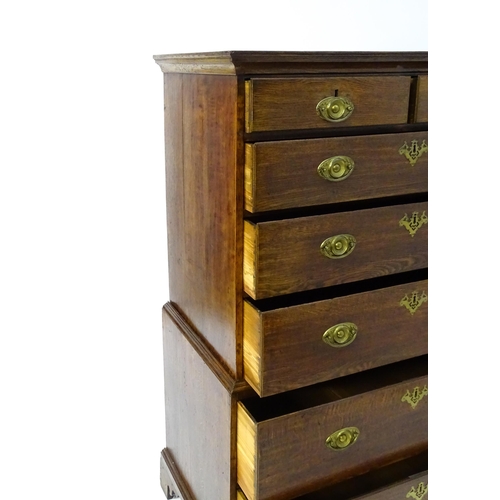 1448 - A late 19thC oak chest on chest, with a moulded cornice above two short over five graduated drawers ... 