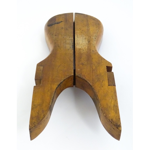 1192 - An early 20thC folding boot jack opening to reveal a pair of steel boot / button hook tools. Approx.... 