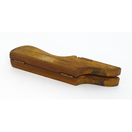 1192 - An early 20thC folding boot jack opening to reveal a pair of steel boot / button hook tools. Approx.... 