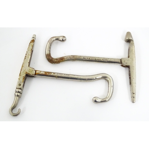 1192 - An early 20thC folding boot jack opening to reveal a pair of steel boot / button hook tools. Approx.... 