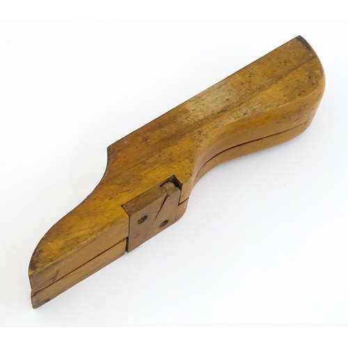 1192 - An early 20thC folding boot jack opening to reveal a pair of steel boot / button hook tools. Approx.... 