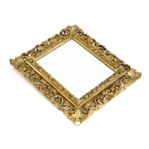 1482 - An early 20thC giltwood and gesso mirror with a pierced surround.  13