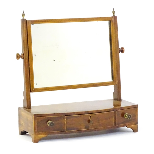 1537 - A 19thC mahogany toilet mirror with decorative inlay and three short drawers. 22