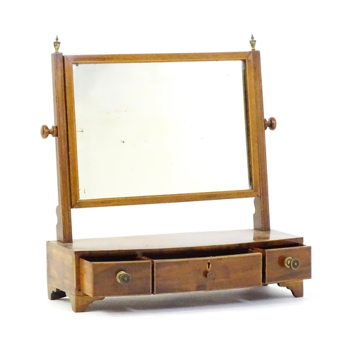 1537 - A 19thC mahogany toilet mirror with decorative inlay and three short drawers. 22