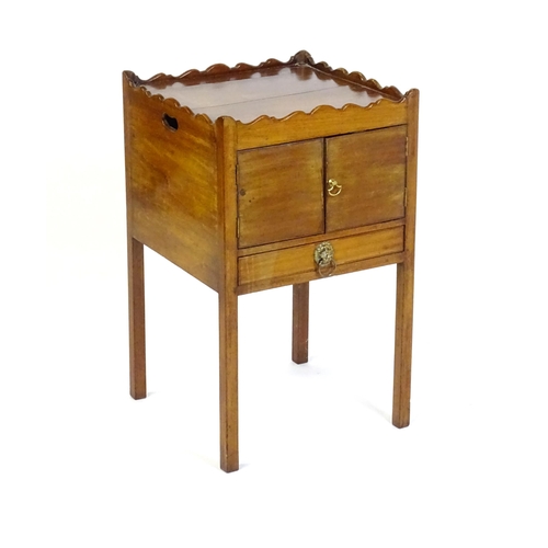 1449 - A Georgian mahogany tray top cabinet with a moulded surround, pierced hand holds, a cupboard to the ... 