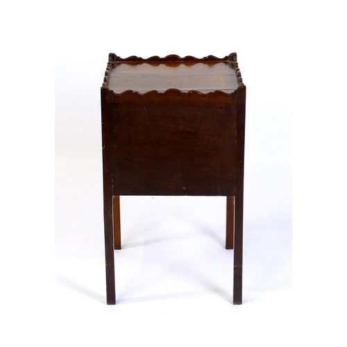 1449 - A Georgian mahogany tray top cabinet with a moulded surround, pierced hand holds, a cupboard to the ... 