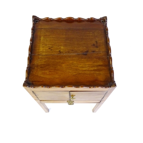 1449 - A Georgian mahogany tray top cabinet with a moulded surround, pierced hand holds, a cupboard to the ... 