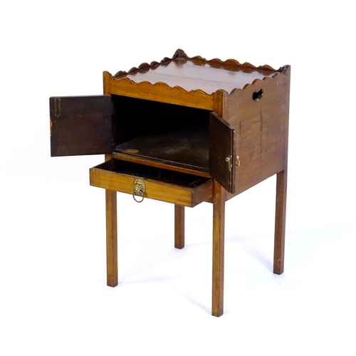 1449 - A Georgian mahogany tray top cabinet with a moulded surround, pierced hand holds, a cupboard to the ... 