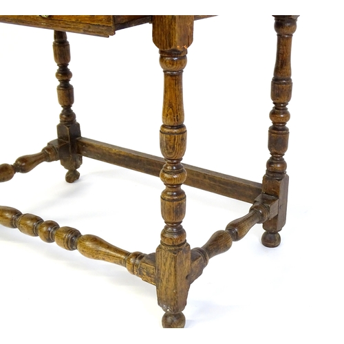 1469 - An 18thC oak side table with a moulded top above a single long frieze drawer, the table raised on tu... 