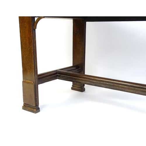 1481 - A Georgian oak two drawer table with a rectangular top above two short drawers with turned knob hand... 