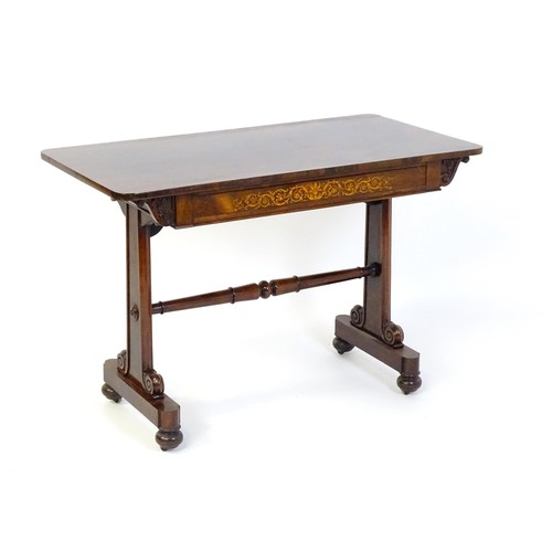 A 19thC rosewood centre table of exceptional quality, the figured rosewood top above a single frieze drawer with satinwood marquetry decoration and an opposing false drawer with matched marquetry decoration. The carved brackets to the underside depicting foliage in flower and raised on two plinths united by a turned stretcher. The base having scrolled brackets and raised on squat bun feet terminating in small castors. 42" wide x 22" deep x 28" high.