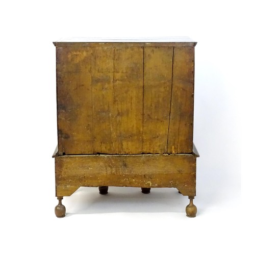 1463 - An early 18thC walnut veneered chest on stand, the moulded top above two short over three long gradu... 