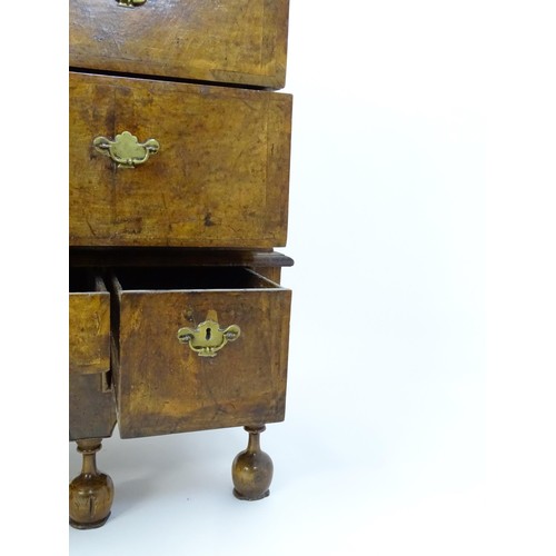 1463 - An early 18thC walnut veneered chest on stand, the moulded top above two short over three long gradu... 