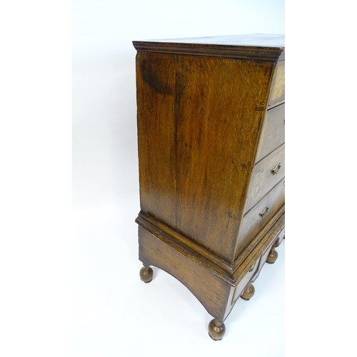 1463 - An early 18thC walnut veneered chest on stand, the moulded top above two short over three long gradu... 