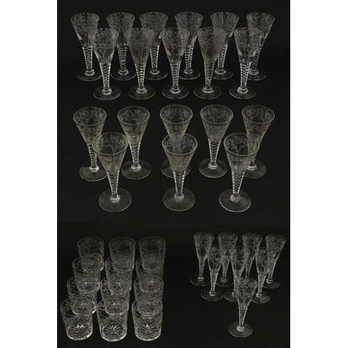 295 - A quantity of various crystal drinking glasses with cut decoration and etched rose detail, to includ... 