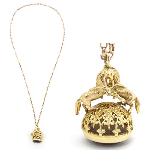 769 - A 9ct gold pendant fob seal surmounted by a pair of prancing horses / ponies and set with facet cut ... 