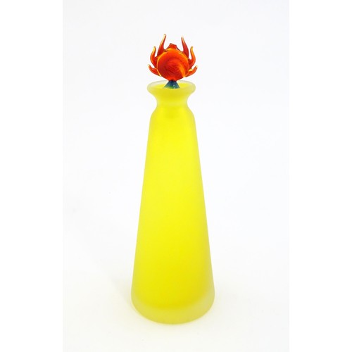 247 - An art glass scent bottle of conical form with yellow, orange and blue detail. Together with a Frenc... 