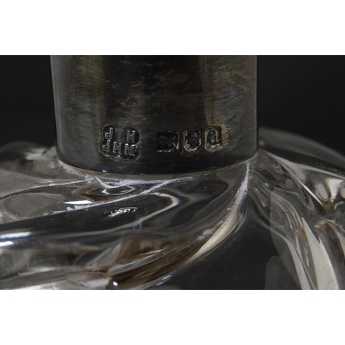 249 - A Victorian shaped glass decanter with trail detail, with silver collar hallmarked London 1896, make... 