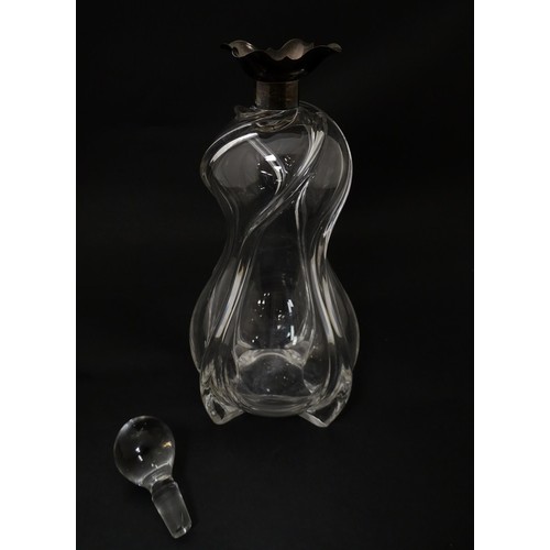 249 - A Victorian shaped glass decanter with trail detail, with silver collar hallmarked London 1896, make... 