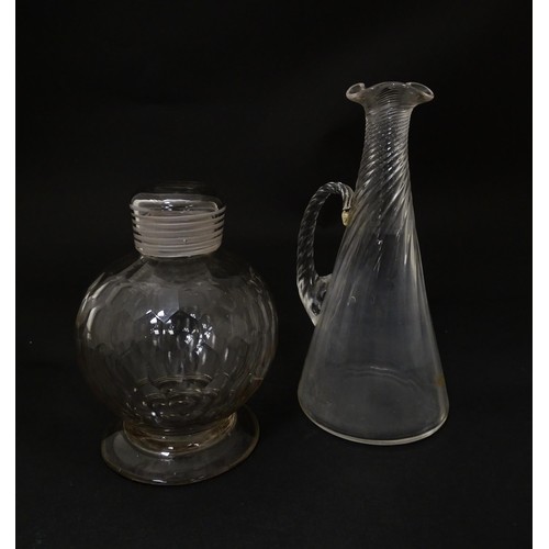 270A - Two items of glassware to include a 19thC facet cut glass bottle of globular form with screw top and... 