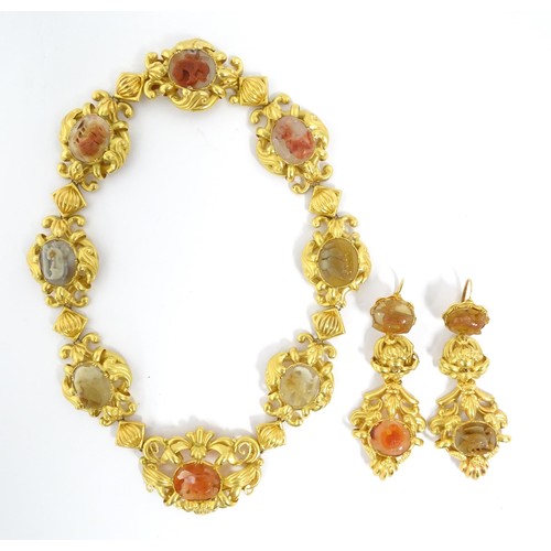 766 - A 19thC Continental gold and gilt metal parure suite of jewellery comprising necklace and drop earri... 