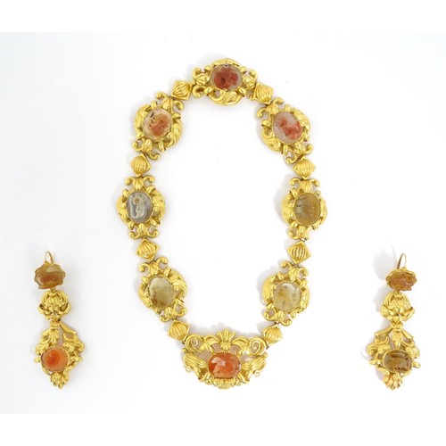 766 - A 19thC Continental gold and gilt metal parure suite of jewellery comprising necklace and drop earri... 