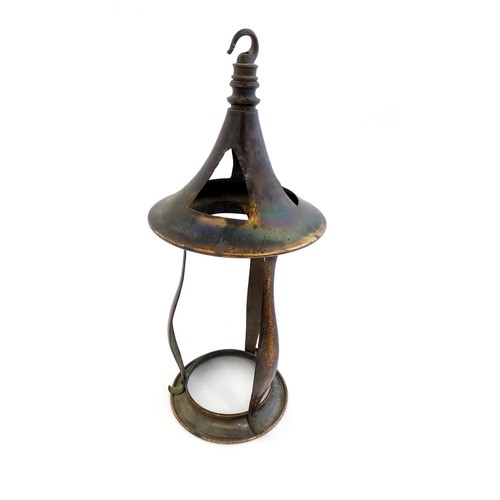 1055 - An Arts & Crafts copper pendant light frame of lantern form, the copper supports with hammered decor... 