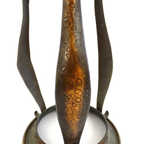 1055 - An Arts & Crafts copper pendant light frame of lantern form, the copper supports with hammered decor... 