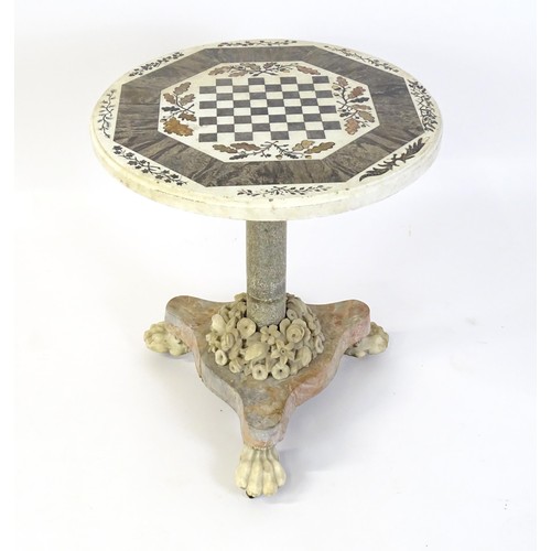 1441 - A marble games table / occasional table with a circular top and inlaid marble decoration. The top ha... 