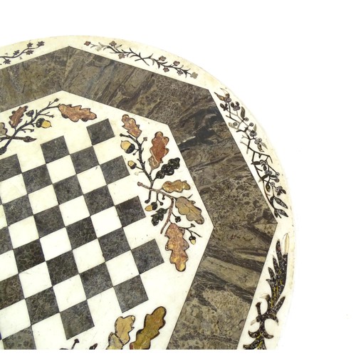 1441 - A marble games table / occasional table with a circular top and inlaid marble decoration. The top ha... 