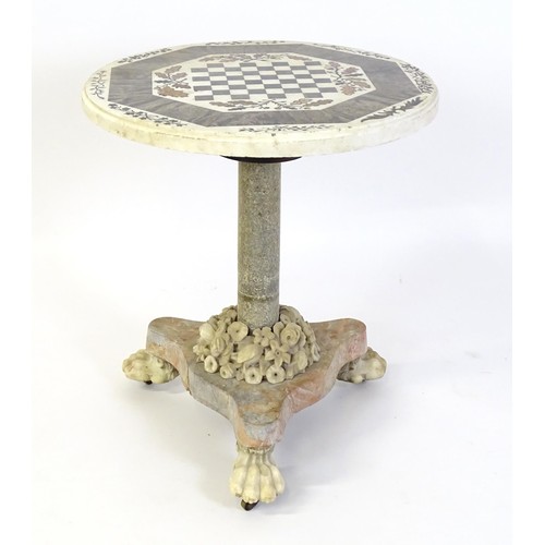 1441 - A marble games table / occasional table with a circular top and inlaid marble decoration. The top ha... 