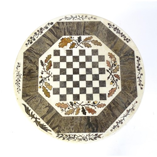 1441 - A marble games table / occasional table with a circular top and inlaid marble decoration. The top ha... 