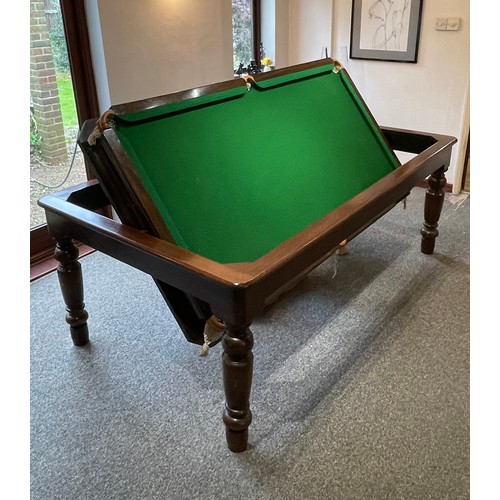 1559 - A 20thC oak combination dining / snooker table, with revolving mechanism and slate base, approx 84 1... 