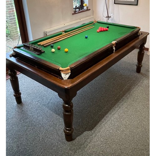 1559 - A 20thC oak combination dining / snooker table, with revolving mechanism and slate base, approx 84 1... 