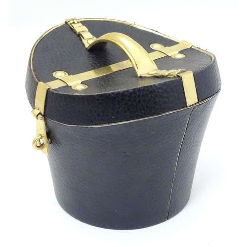 85 - A 21stC novelty brass caddy / container formed as a saddle shaped hat box with black leather coverin... 