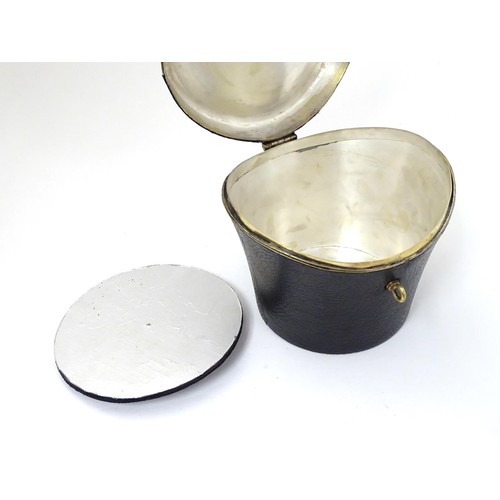 85 - A 21stC novelty brass caddy / container formed as a saddle shaped hat box with black leather coverin... 