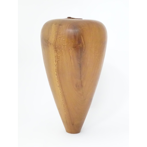 133 - A wooden vase of tapering form. Approx. 16